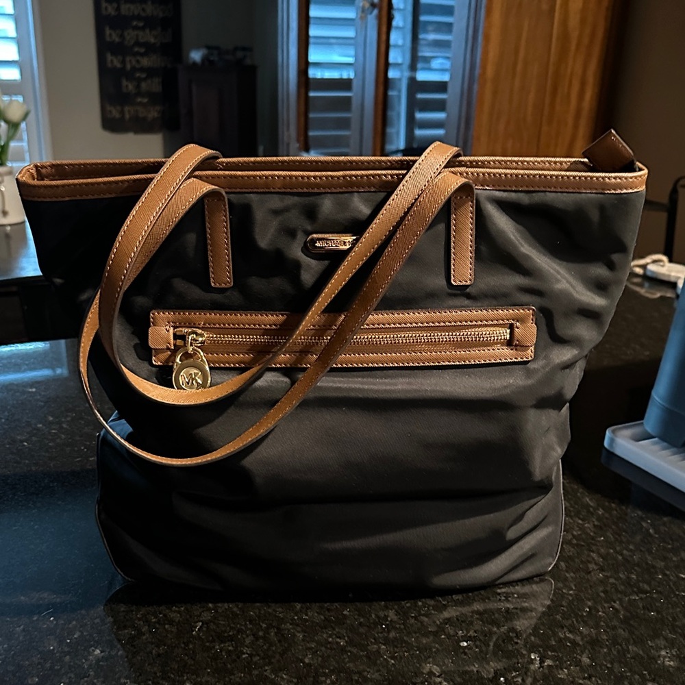 Michael Kors Black Tote with Brown Leather Trim and Gold Charm